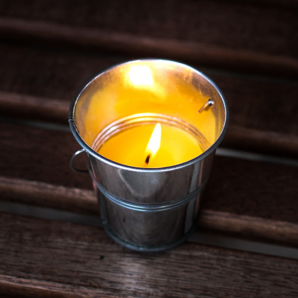 Citronella mosquito candle in a bucket