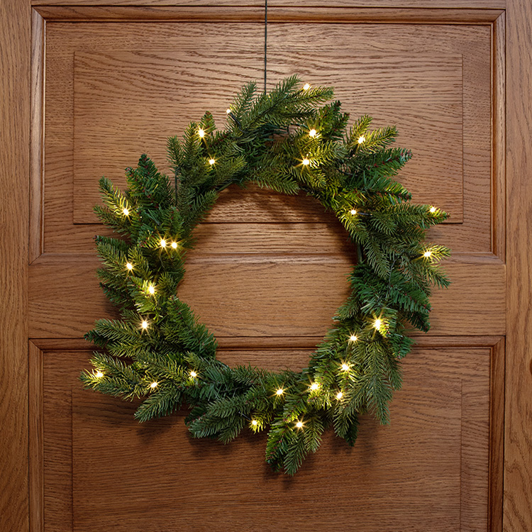 Door wreath with twilight sensor