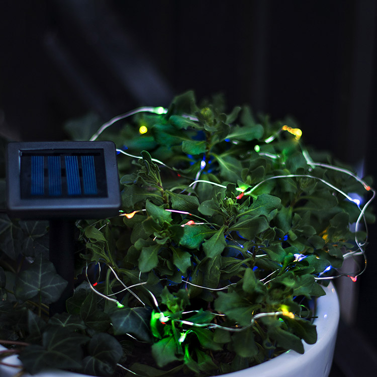 Solar-powered string lights with coloured lamps