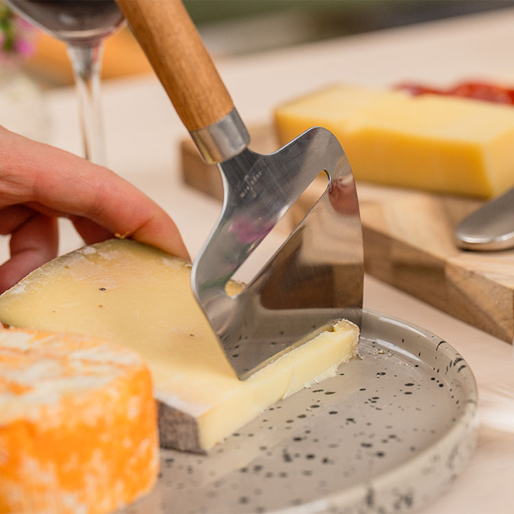 Cheese slicer with cheese knife