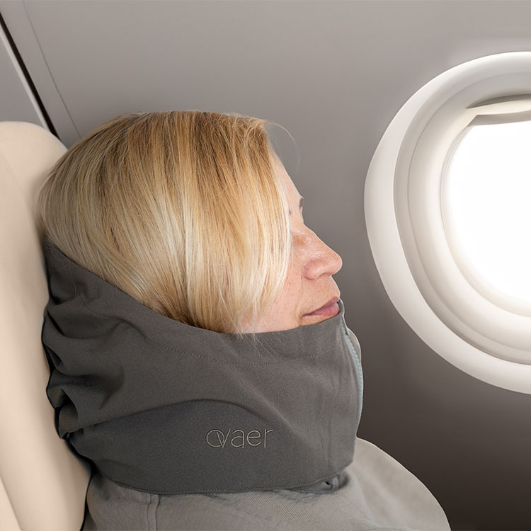 Travel pillow with a hood