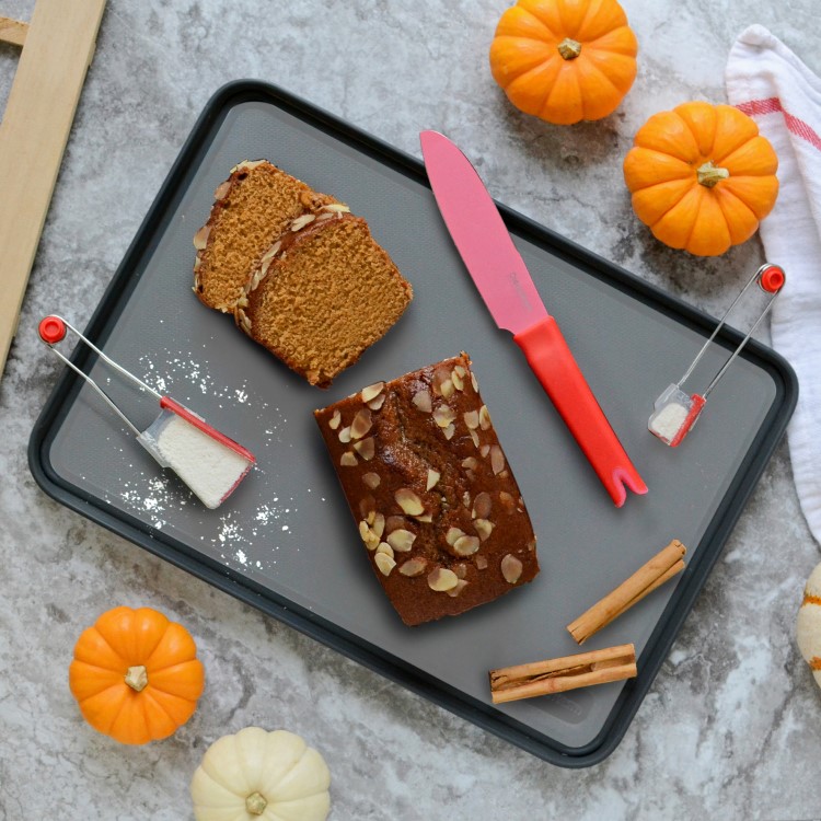 Plastic cutting board with fold-up edge