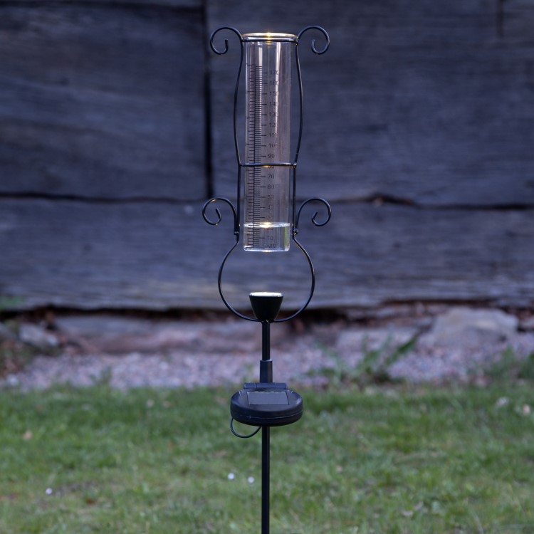 Rain gauge with solar lighting