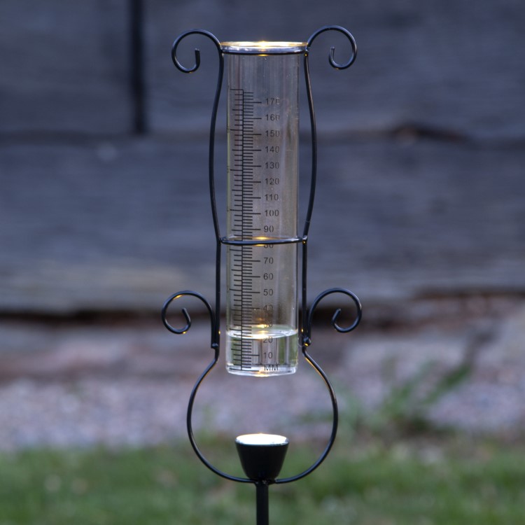 Rain gauge with solar lighting