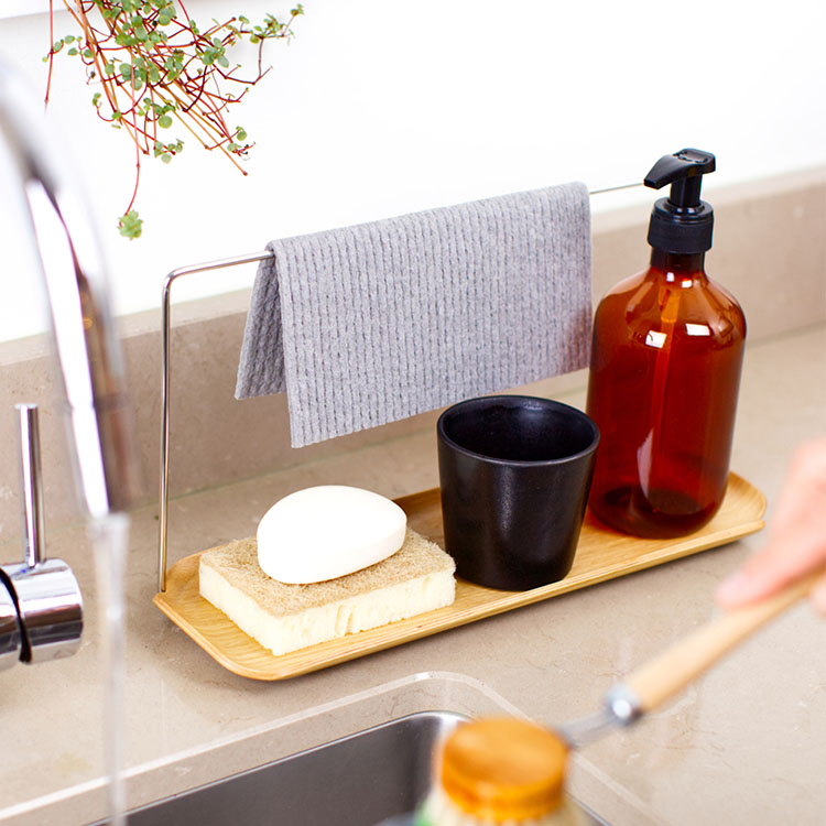 Water resistant tray with dishcloth holder